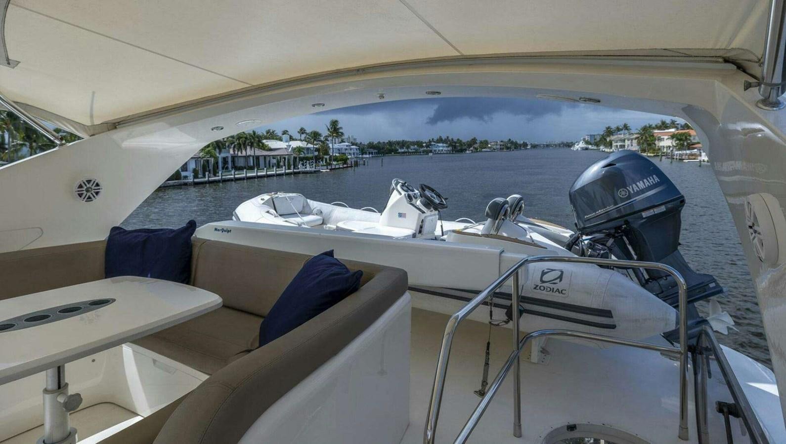 a boat with a motor aboard TRINITY Yacht for Sale