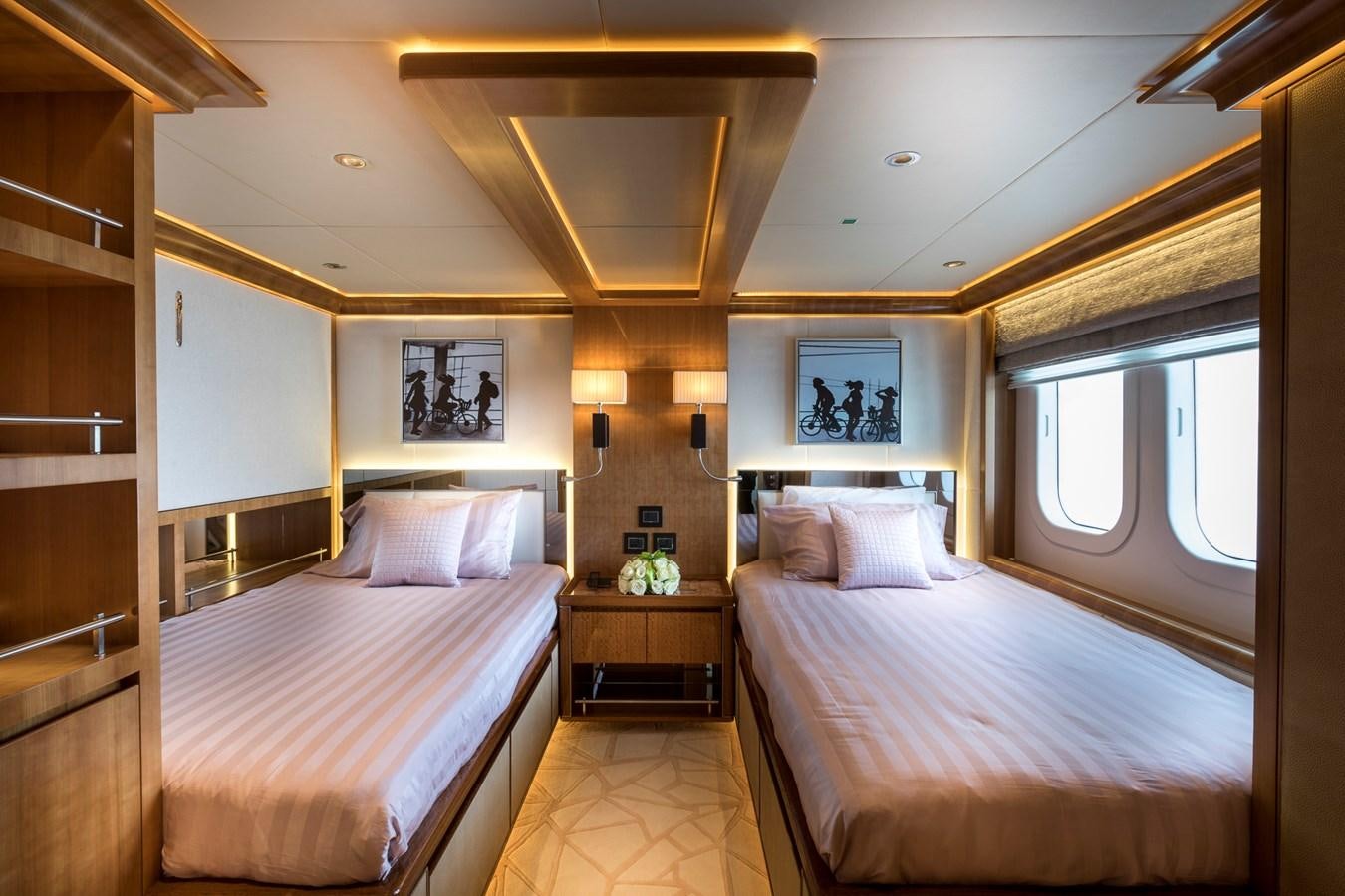a bedroom with two beds aboard SEHAMIA Yacht for Sale