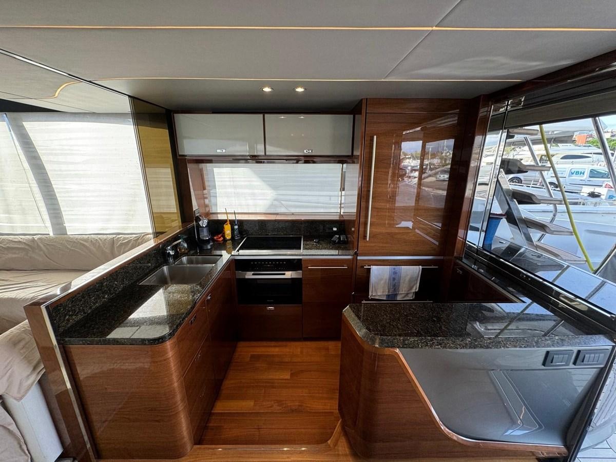 a kitchen with a large window aboard ALEXANDRA II Yacht for Sale