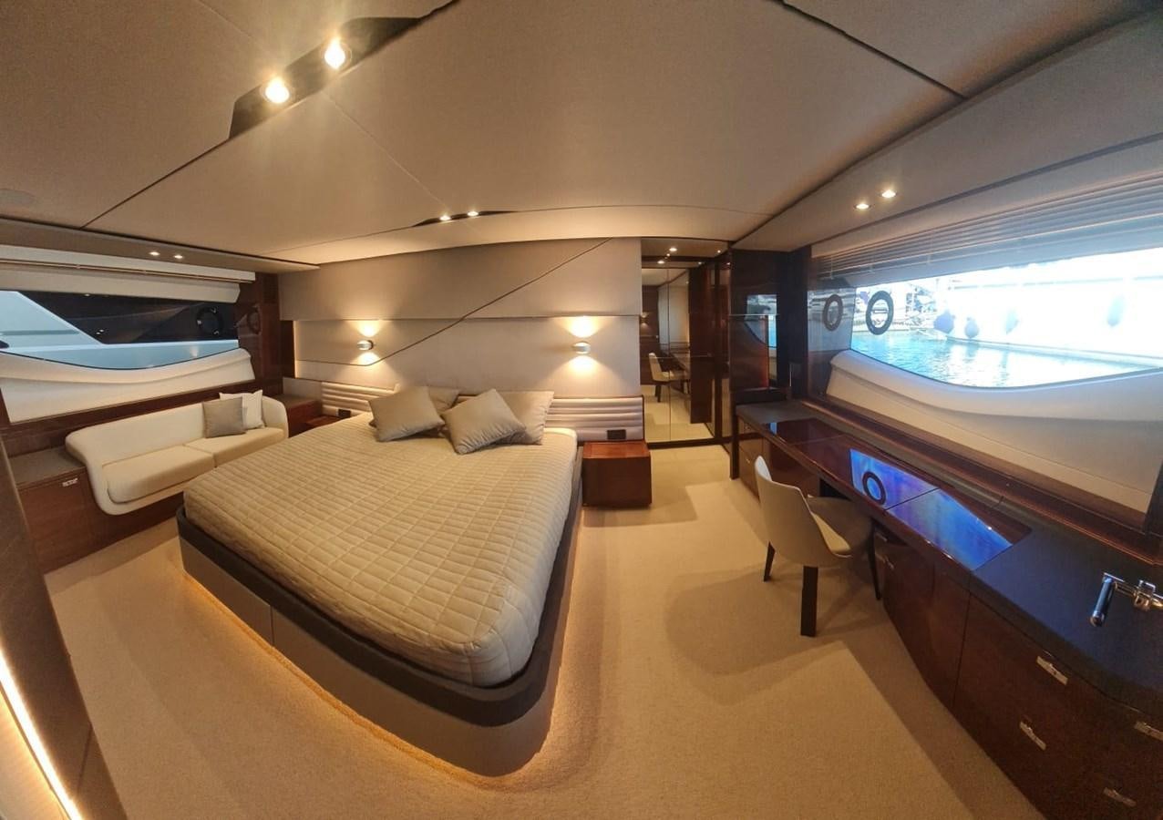a hotel room with a bed and a large mirror aboard ALEXANDRA II Yacht for Sale