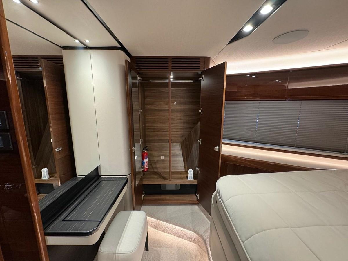 a room with a bed and a closet aboard ALEXANDRA II Yacht for Sale