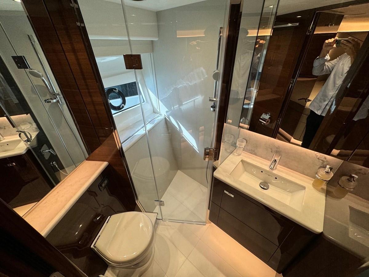 a bathroom with a large mirror aboard ALEXANDRA II Yacht for Sale