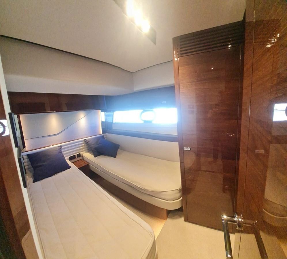 a room with a bed and a large mirror aboard ALEXANDRA II Yacht for Sale