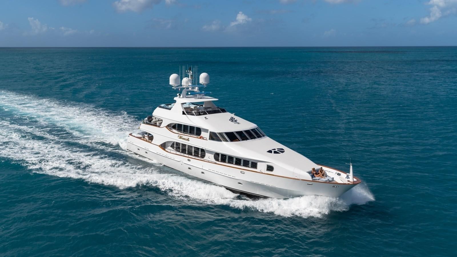 a white yacht in the ocean aboard TOUCH Yacht for Sale
