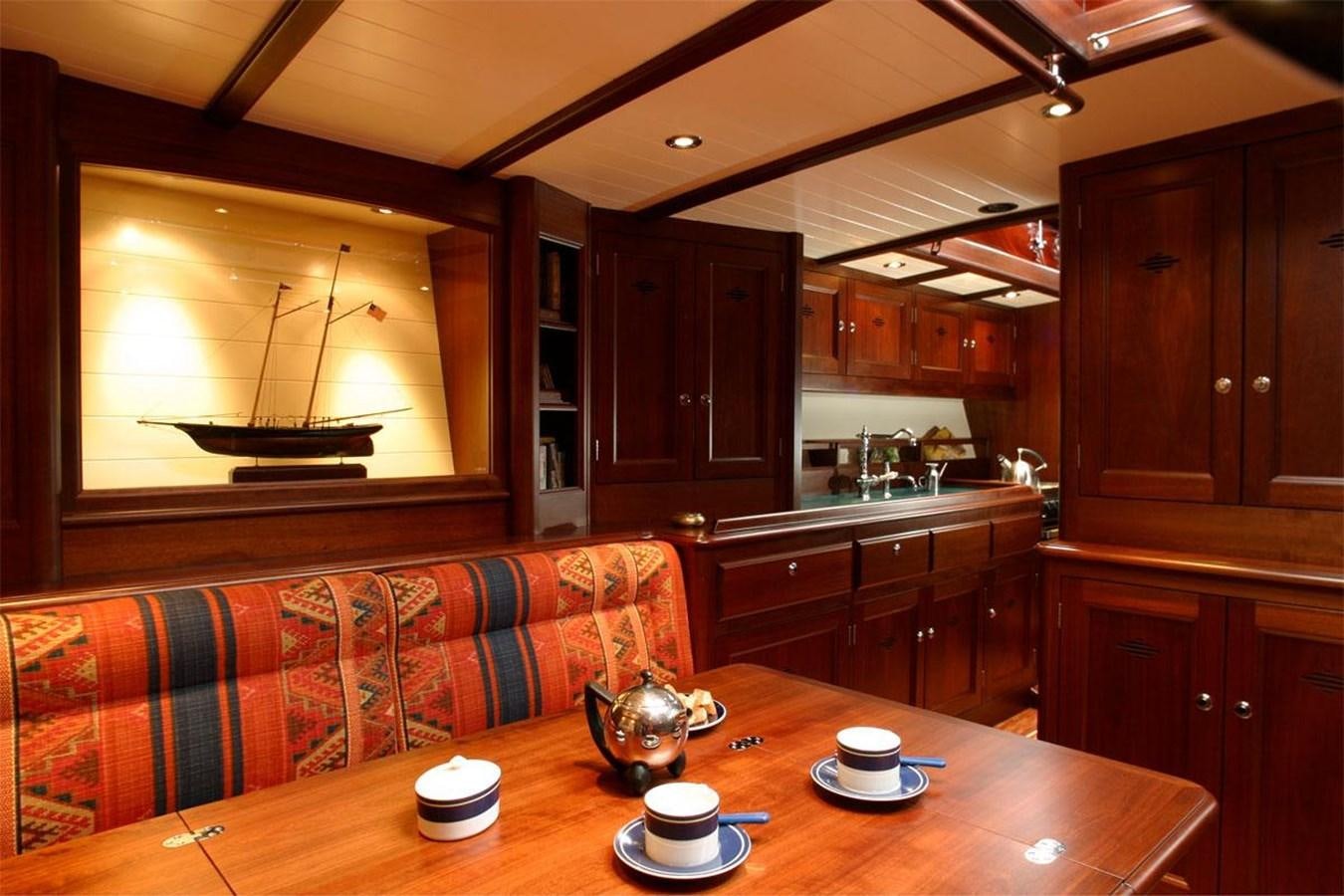 a kitchen with wooden cabinets aboard ALDEBARAN Yacht for Sale