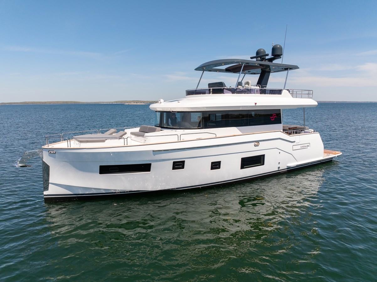 a white yacht in the water aboard NEW 2023 SIRENA 68 Yacht for Sale