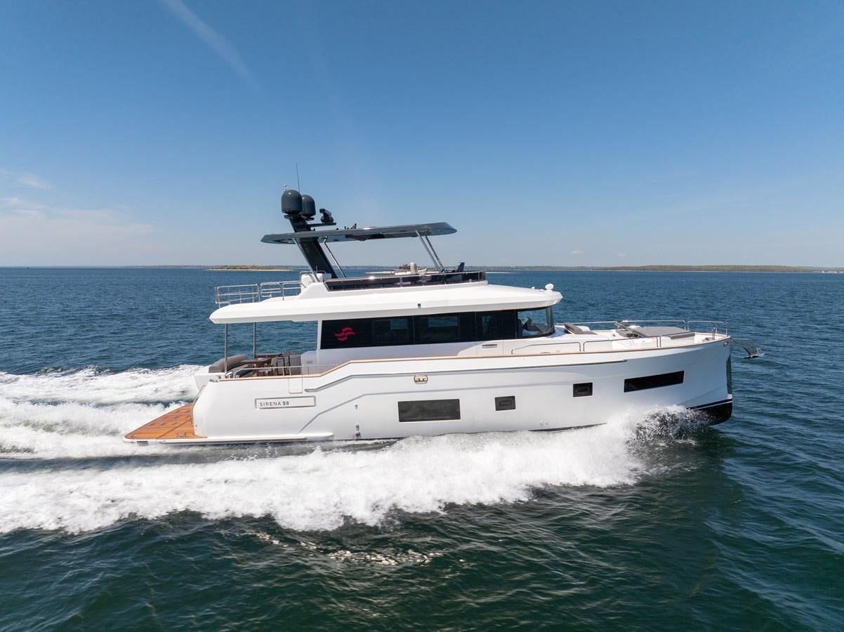 a white boat on the water aboard NEW 2023 SIRENA 68 Yacht for Sale