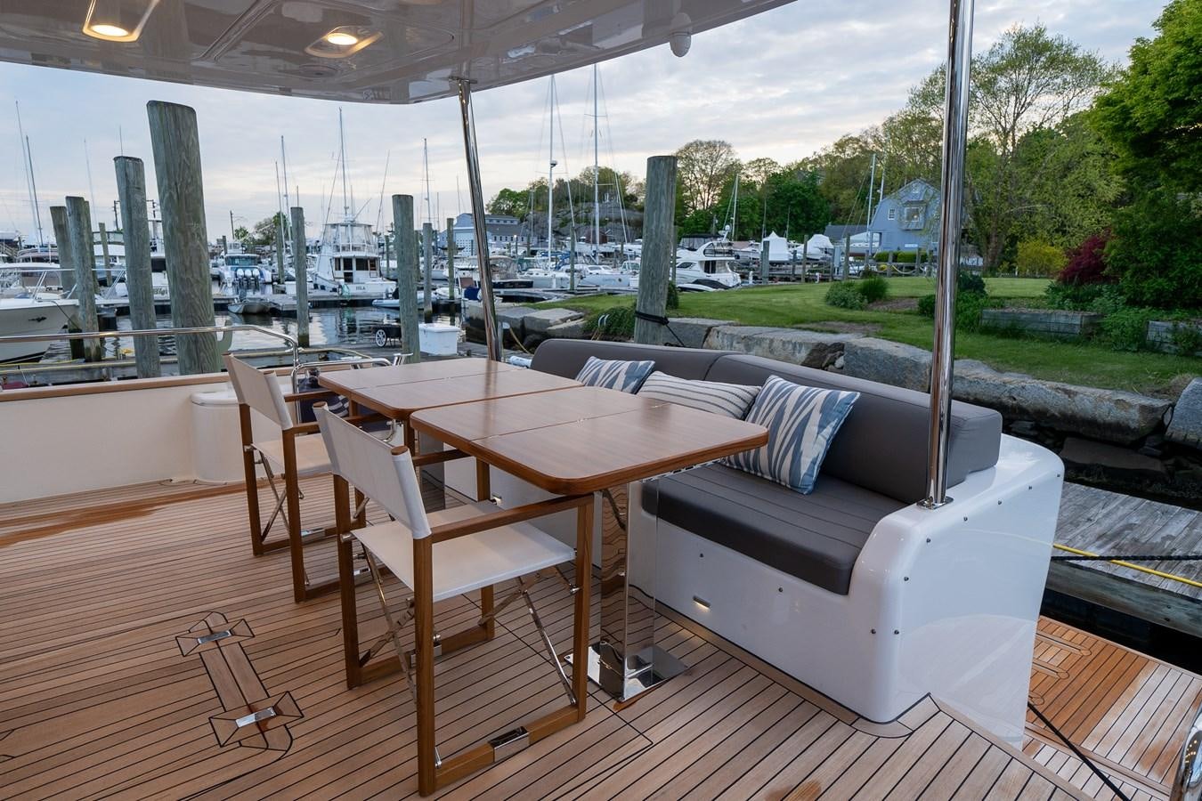 a table and chairs on a deck aboard NEW 2023 SIRENA 68 Yacht for Sale