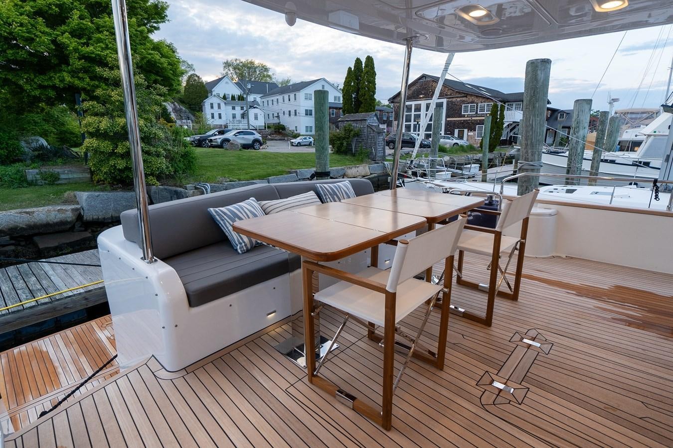 a table and chairs on a deck aboard NEW 2023 SIRENA 68 Yacht for Sale