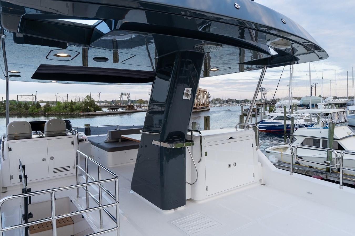 a boat docked at a pier aboard NEW 2023 SIRENA 68 Yacht for Sale