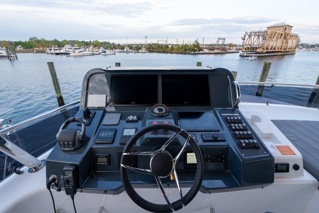 a car on a boat aboard NEW 2023 SIRENA 68 Yacht for Sale