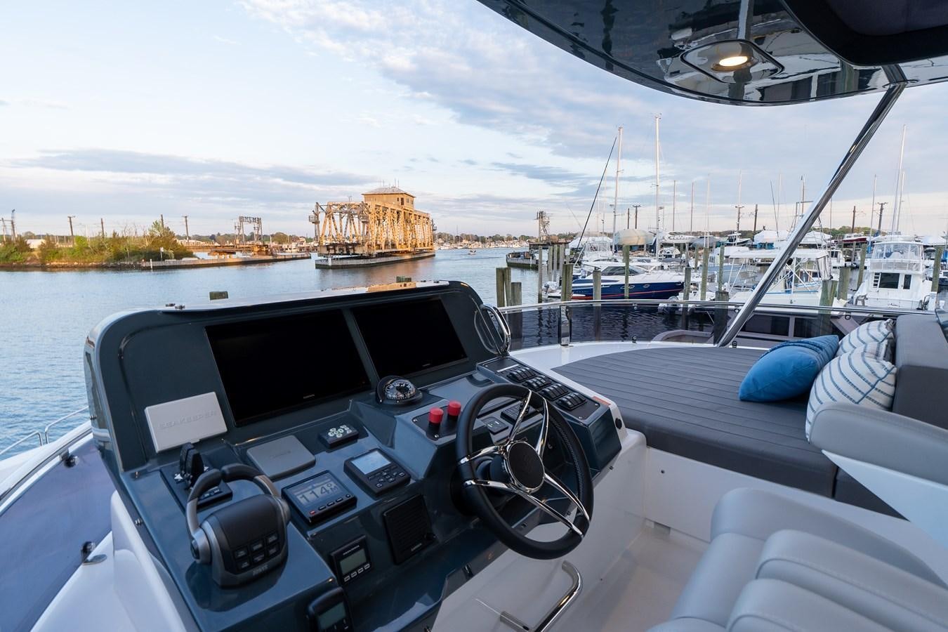 a boat with a view of the water and a boat in the background aboard NEW 2023 SIRENA 68 Yacht for Sale
