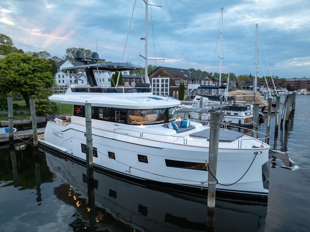 a boat docked at a pier aboard NEW 2023 SIRENA 68 Yacht for Sale