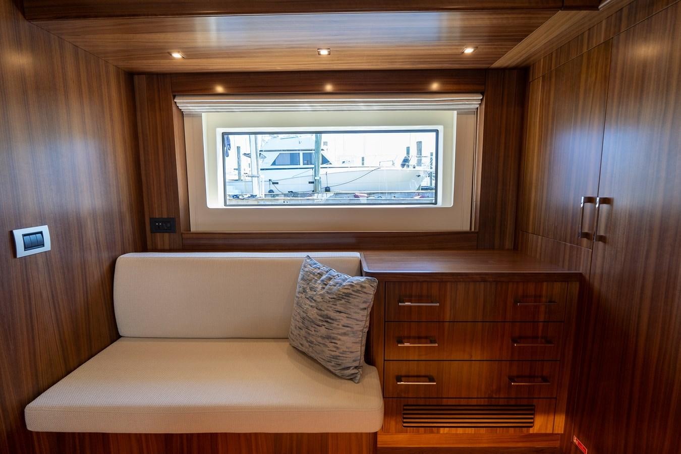 a living room with a couch and a television aboard NEW 2023 SIRENA 68 Yacht for Sale