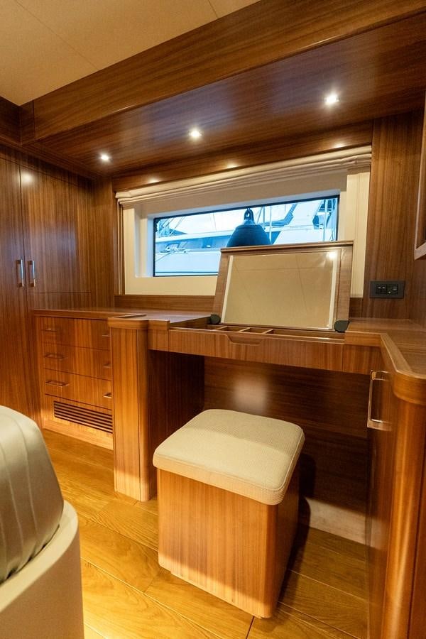 a room with a tv and a table aboard NEW 2023 SIRENA 68 Yacht for Sale