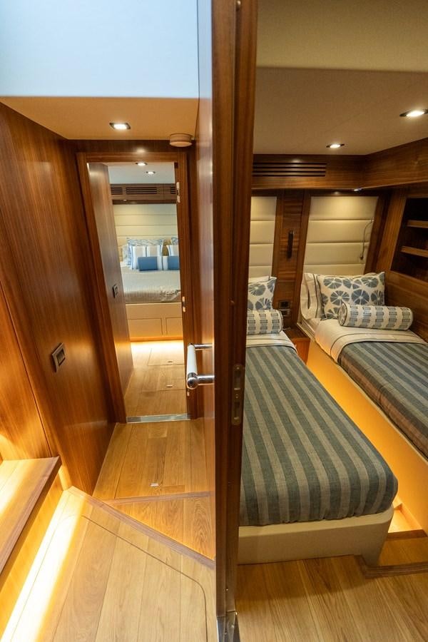 a room with a bed and a mirror aboard NEW 2023 SIRENA 68 Yacht for Sale