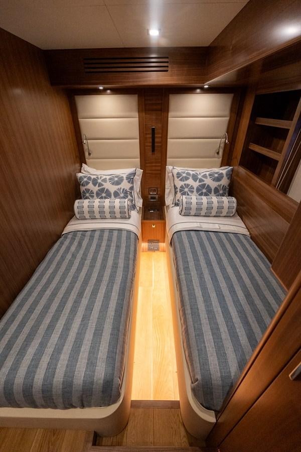 a couple of beds in a cabin aboard NEW 2023 SIRENA 68 Yacht for Sale