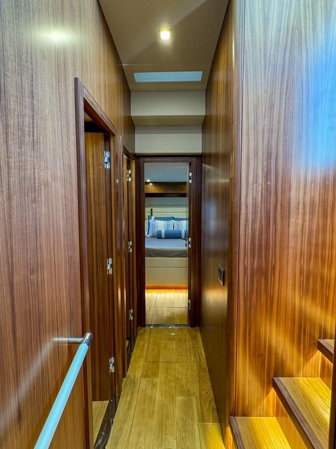 a hallway with wood doors aboard NEW 2023 SIRENA 68 Yacht for Sale