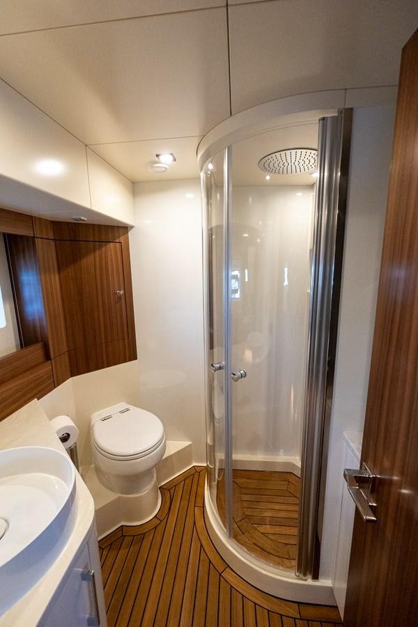 a bathroom with a glass shower aboard NEW 2023 SIRENA 68 Yacht for Sale