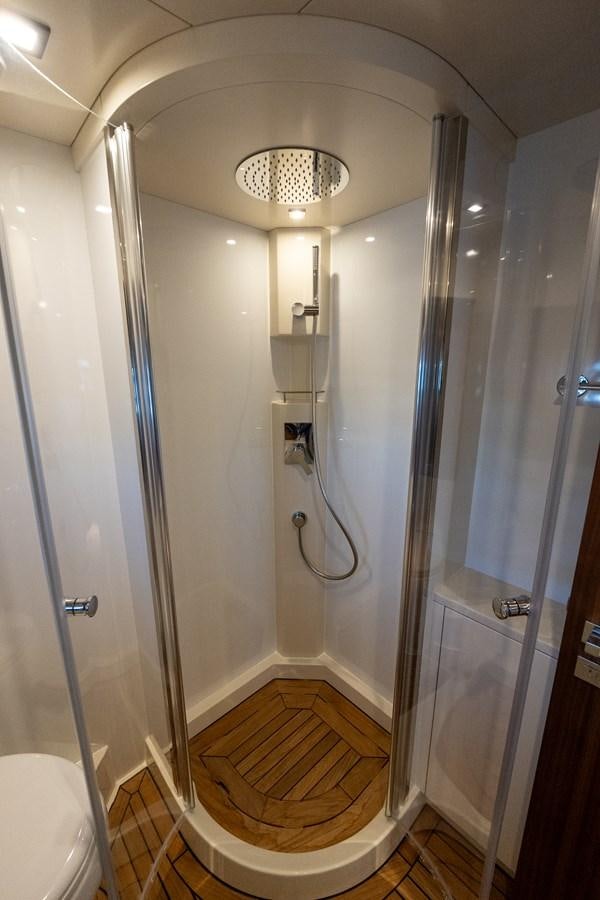 a bathroom with a glass shower aboard NEW 2023 SIRENA 68 Yacht for Sale