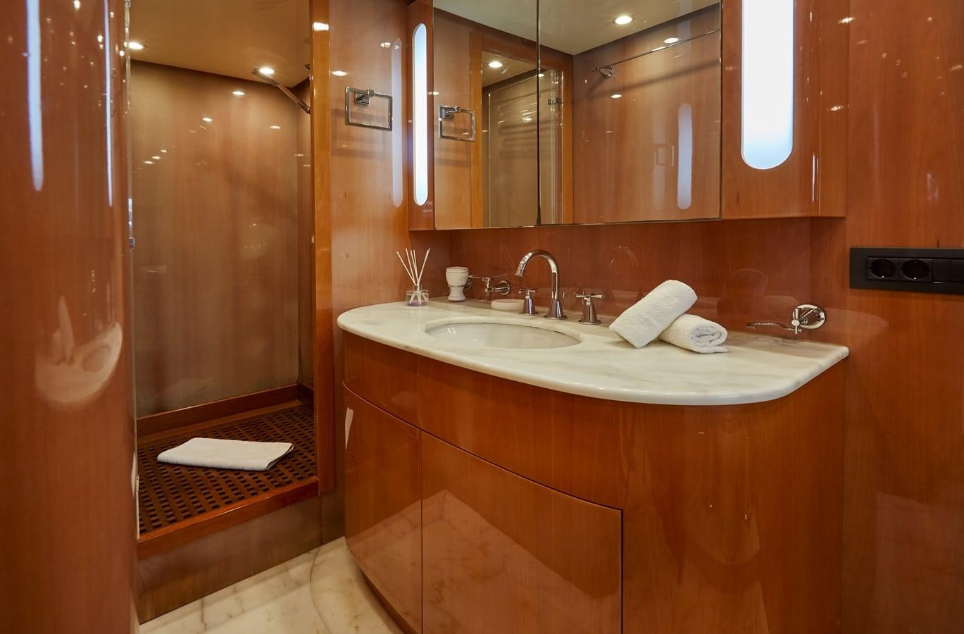 a bathroom with a sink and a mirror aboard LEOPARD 26 FLY Yacht for Sale