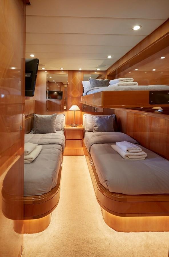 a room with a bed and a couch aboard LEOPARD 26 FLY Yacht for Sale