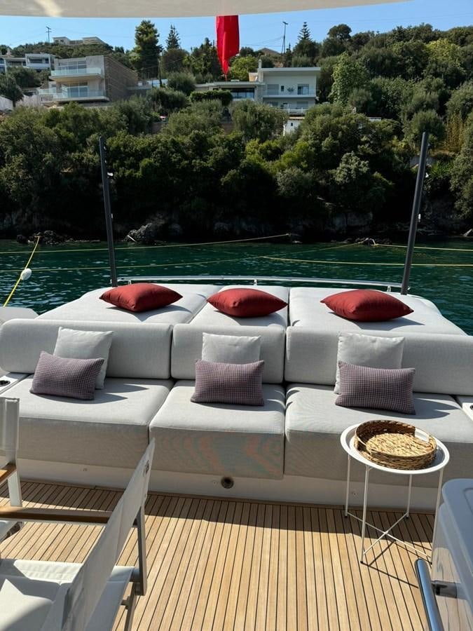 a couch with pillows on it aboard KING LIAM Yacht for Sale