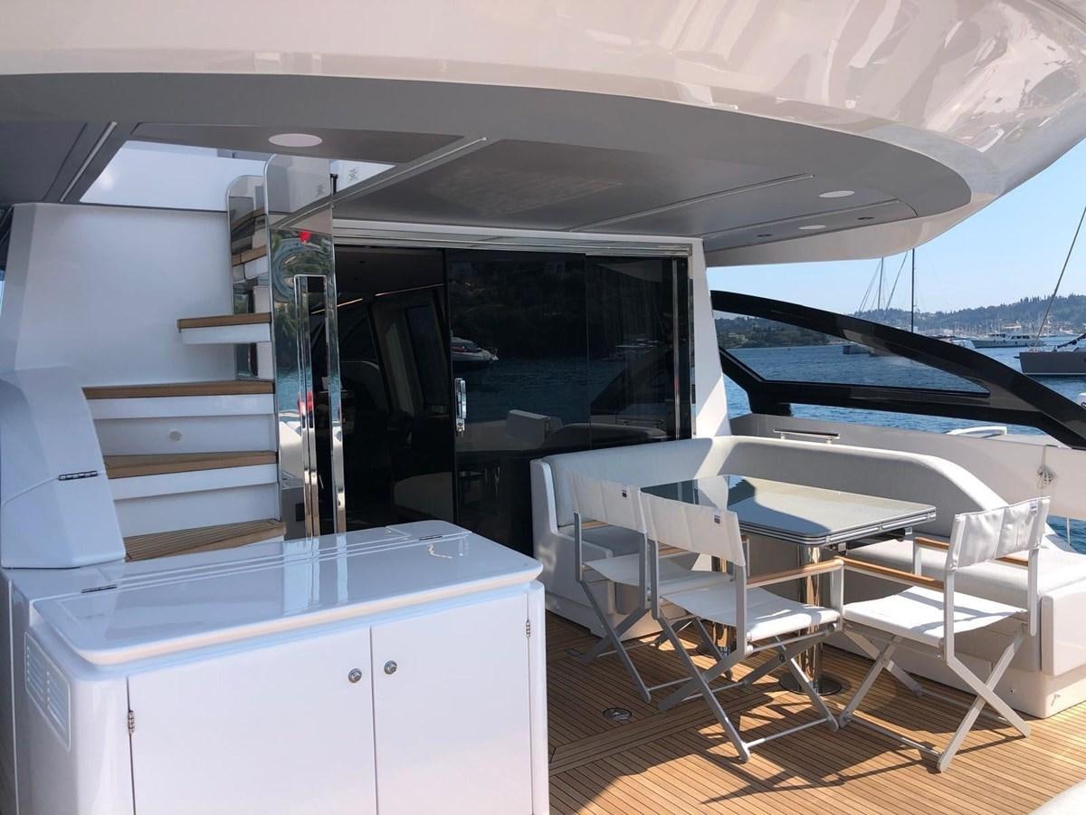 a boat with a deck and chairs aboard KING LIAM Yacht for Sale