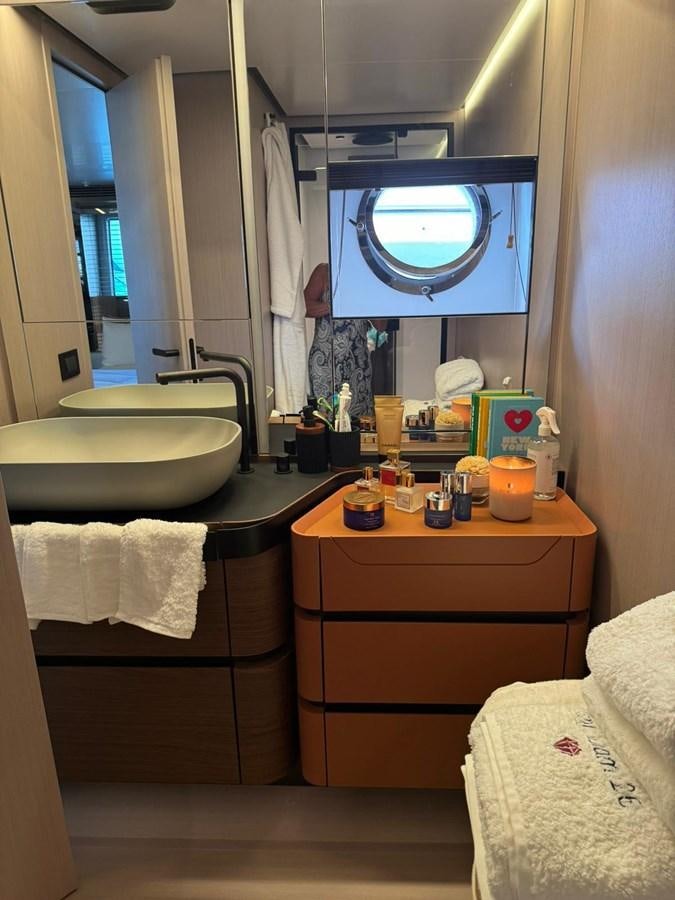 a bathroom with a large mirror aboard KING LIAM Yacht for Sale