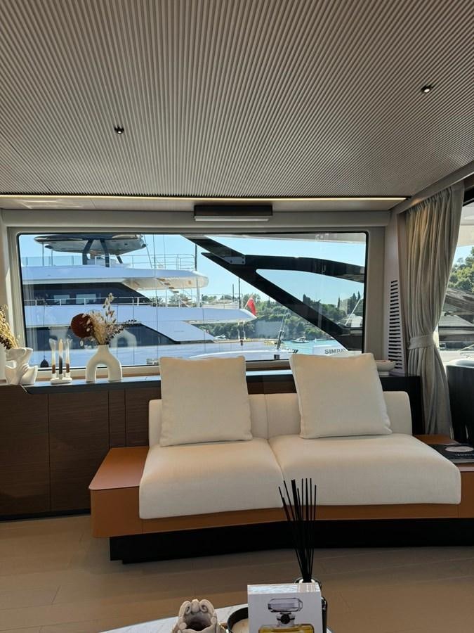 a white couch in a room aboard KING LIAM Yacht for Sale