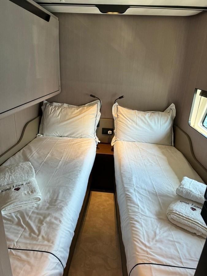 a couple of beds in a room aboard KING LIAM Yacht for Sale
