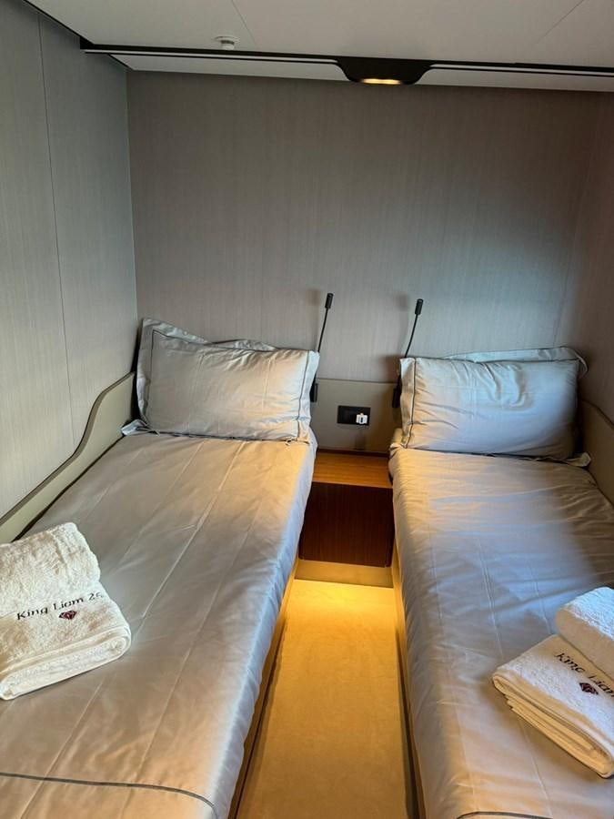 a couple of beds in a room aboard KING LIAM Yacht for Sale