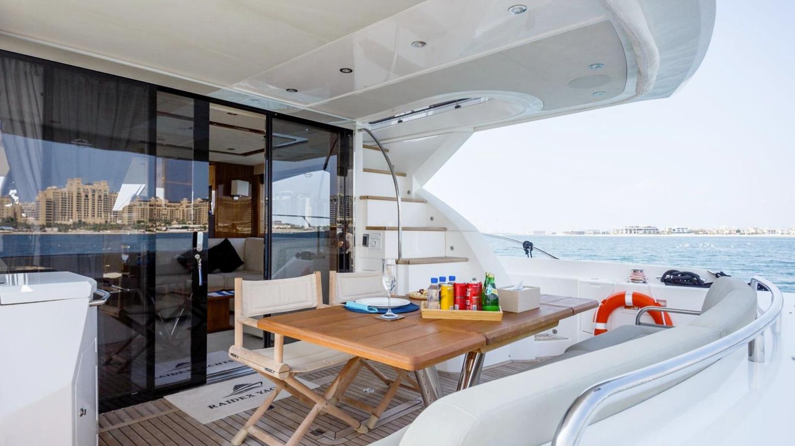 a room with a table and chairs aboard RAIDEX Yacht for Sale