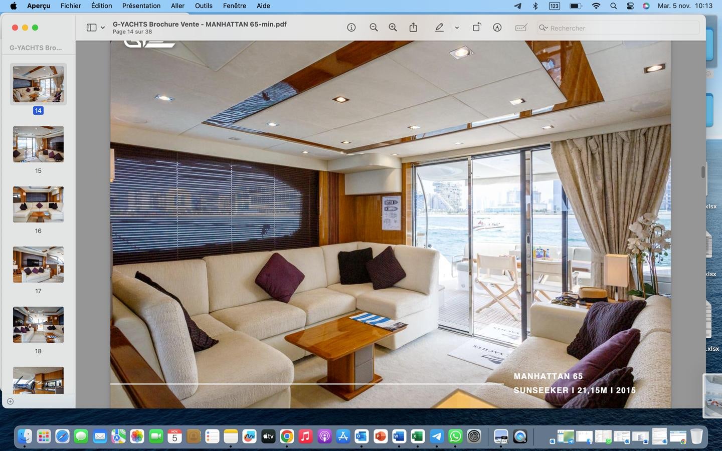 a living room with a couch and a table aboard RAIDEX Yacht for Sale