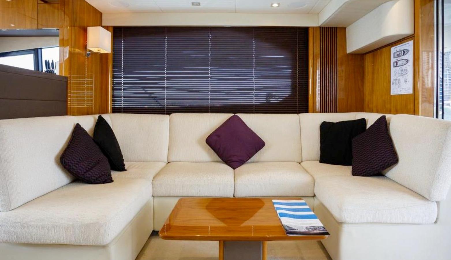 a couch with pillows and pillows aboard RAIDEX Yacht for Sale