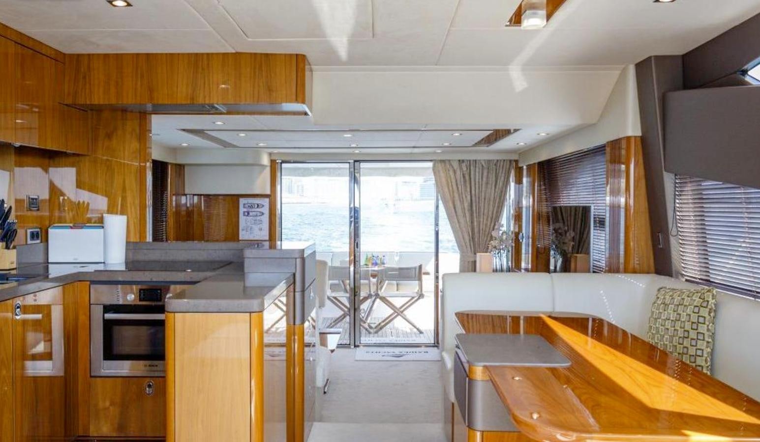 a kitchen and dining room aboard RAIDEX Yacht for Sale