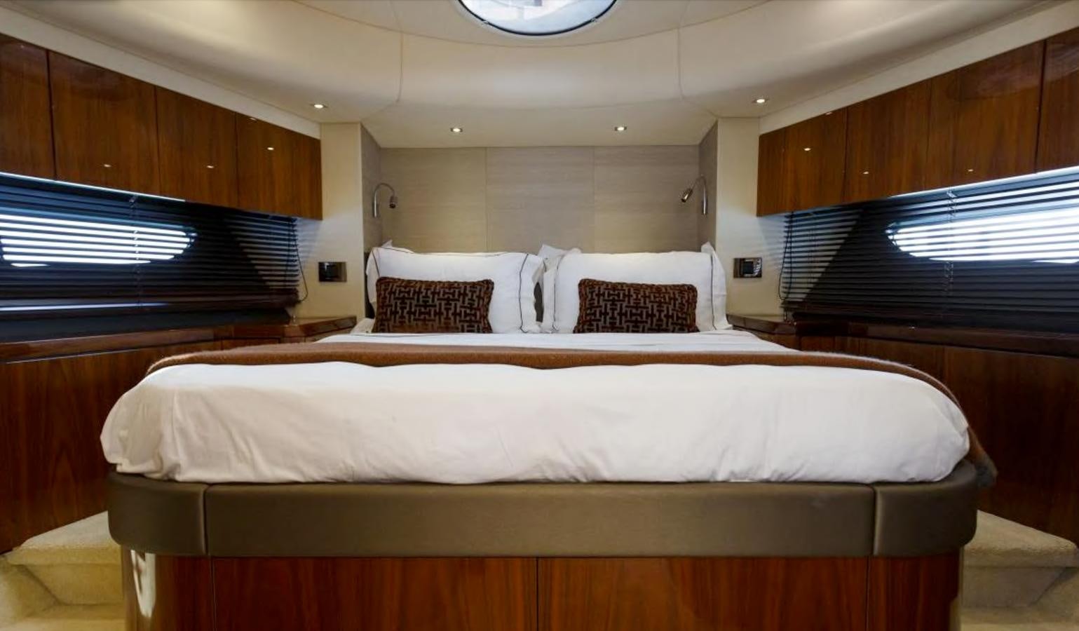 a room with a bed and a desk aboard RAIDEX Yacht for Sale