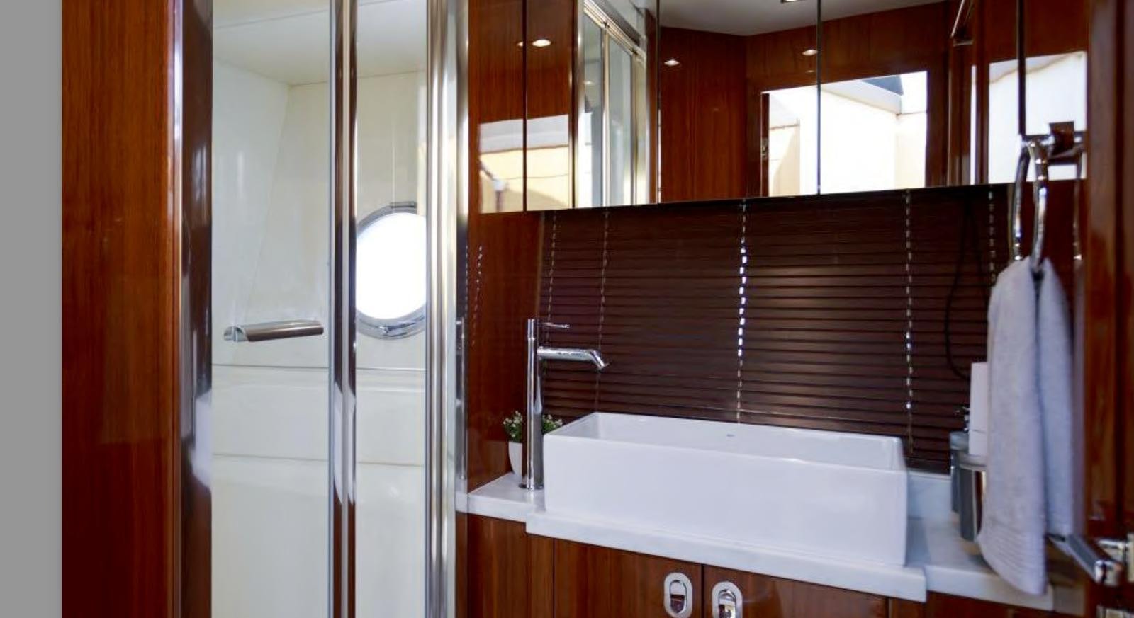 a bathroom with a large bathtub aboard RAIDEX Yacht for Sale