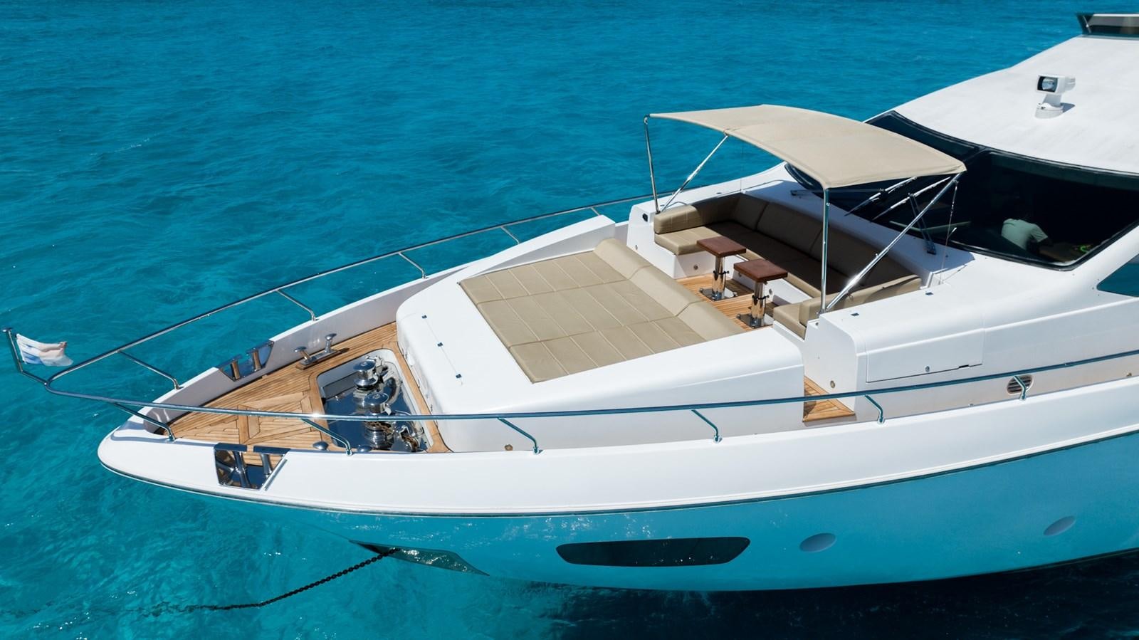 a white boat on the water aboard V&V Yacht for Sale