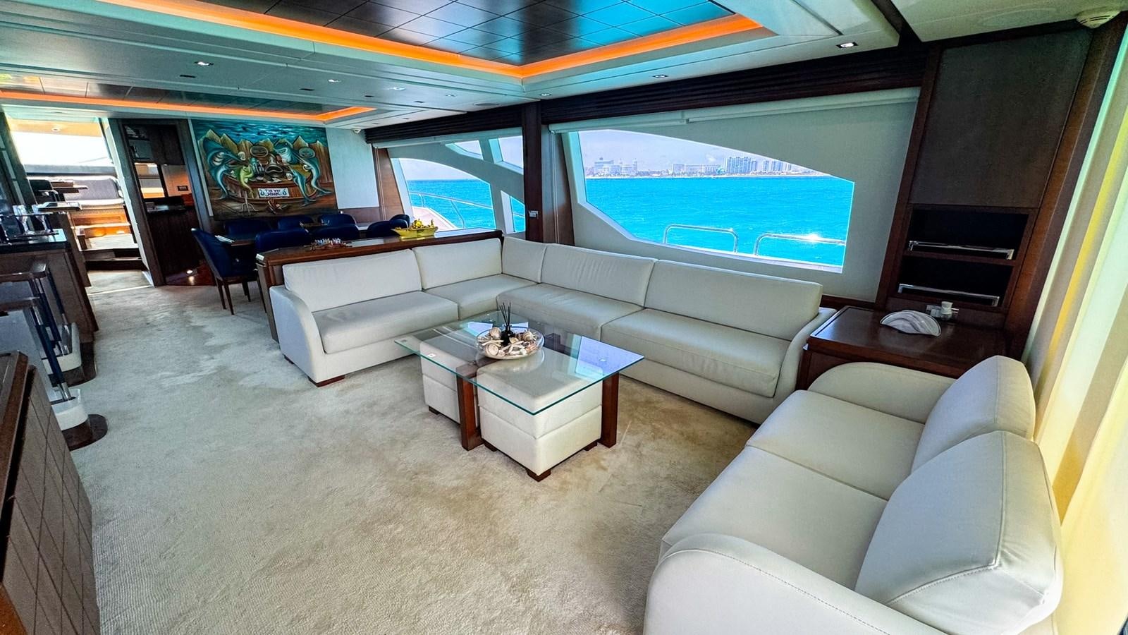 a living room with a large screen aboard V&V Yacht for Sale
