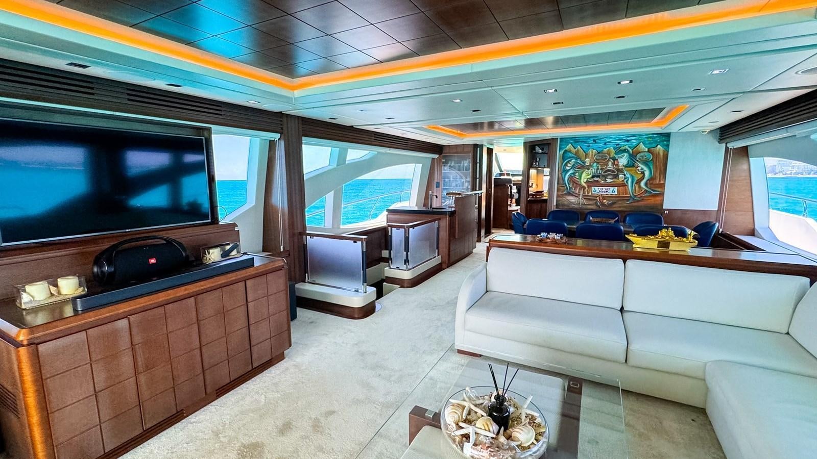 a room with a couch and a tv aboard V&V Yacht for Sale