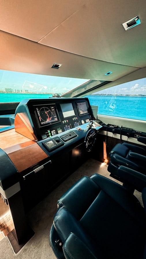 a room with a large window and a view of the ocean aboard V&V Yacht for Sale