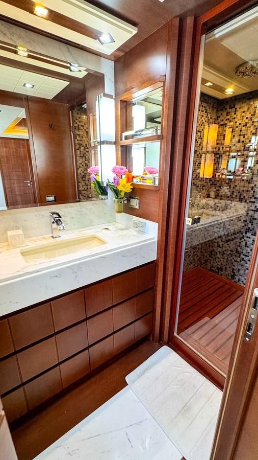 a bathroom with a sink and a mirror aboard V&V Yacht for Sale