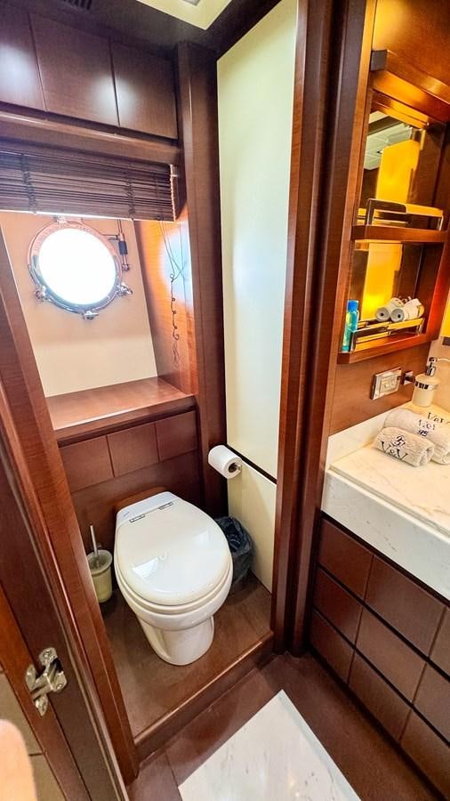 a bathroom with a toilet and a sink aboard V&V Yacht for Sale