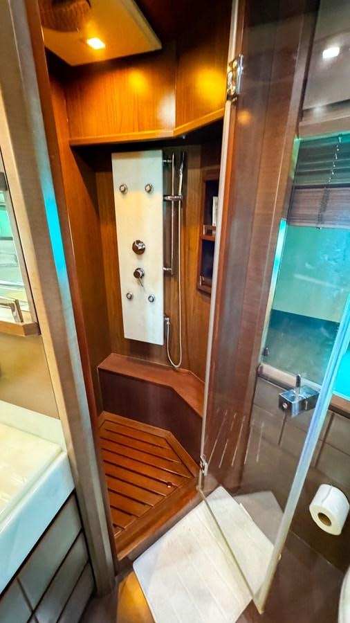 a bathroom with a glass door aboard V&V Yacht for Sale