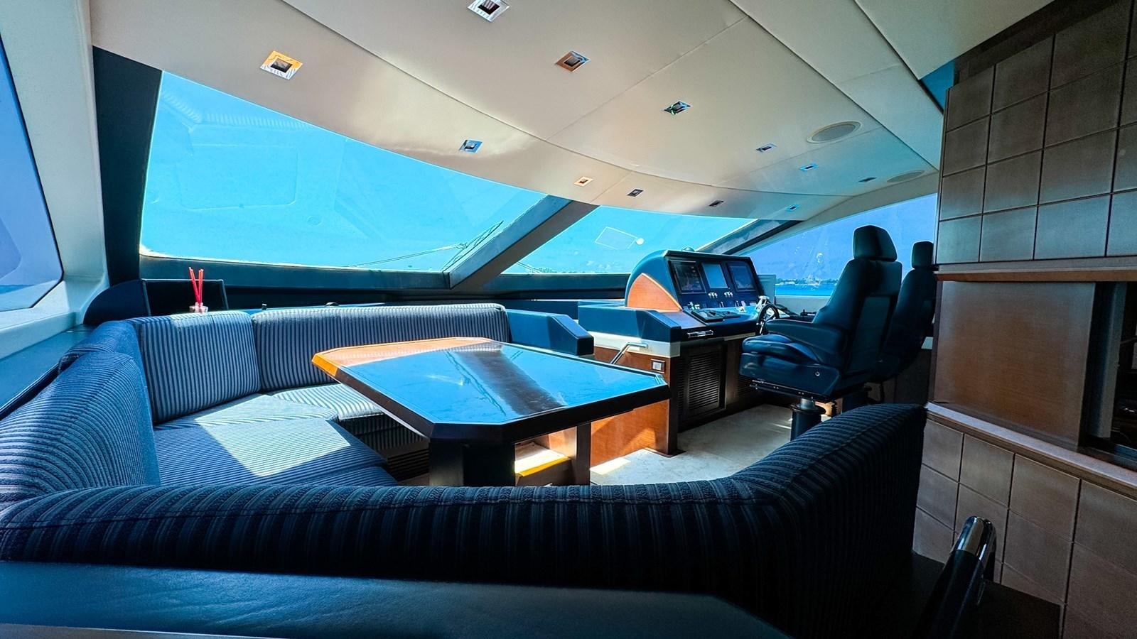 a room with a couch and a table aboard V&V Yacht for Sale