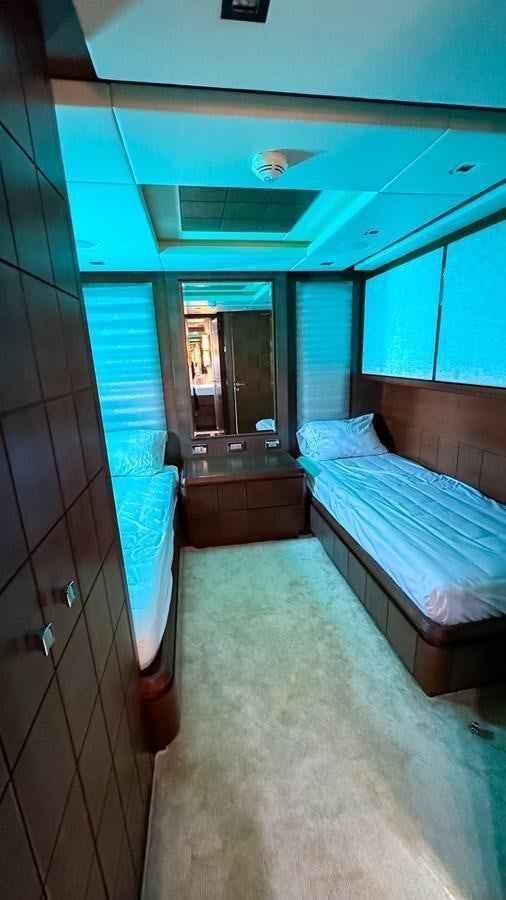 a room with a bed and a mirror aboard V&V Yacht for Sale