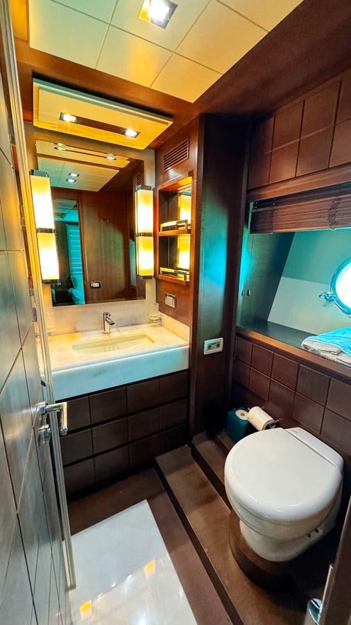 a bathroom with a toilet and a sink aboard V&V Yacht for Sale