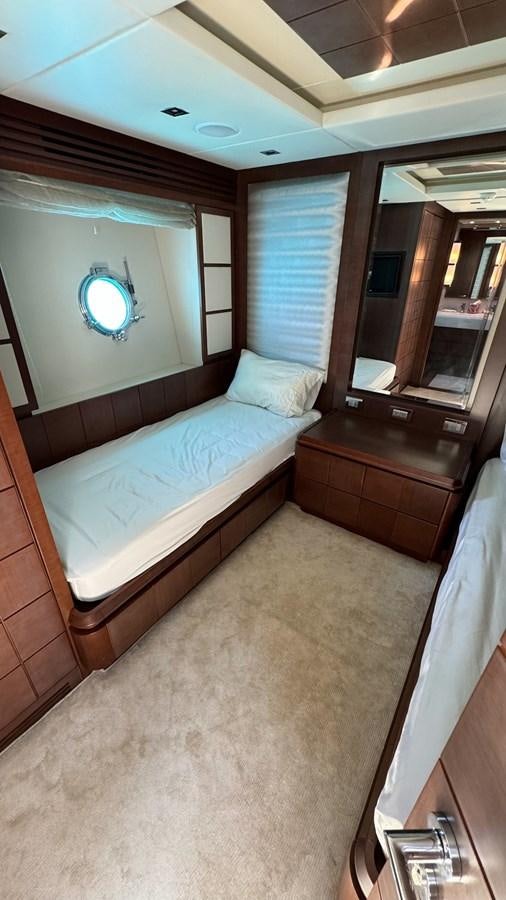 a bedroom with a bed and a mirror aboard V&V Yacht for Sale