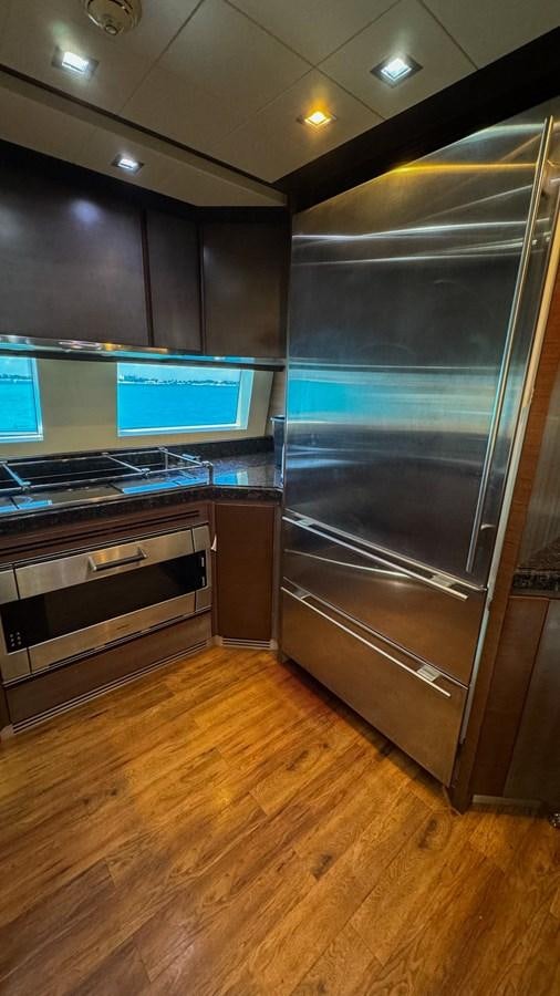 a large kitchen with stainless steel appliances aboard V&V Yacht for Sale